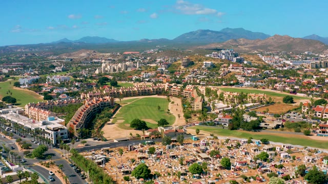SAN JOSE DEL CABO BCS MEXICO-2020: Panning View of Suburban Area with Golf Course and Buildings