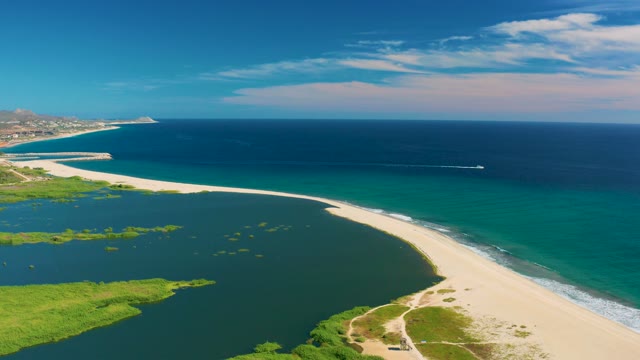 SAN JOSE DEL CABO BCS MEXICO-2020: Gentle Ocean Waves Lapping a Sandy Beach and Lagoon