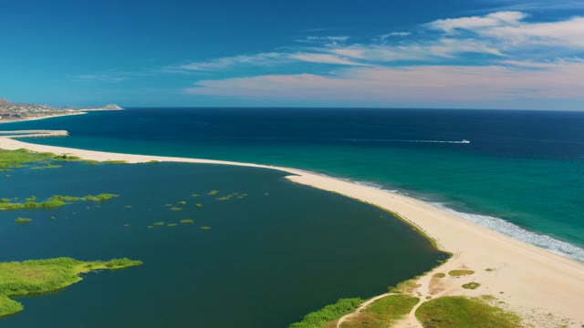 SAN JOSE DEL CABO BCS MEXICO-2020: Sandy Beach, Lagoon, and Ocean with Boat Passing By