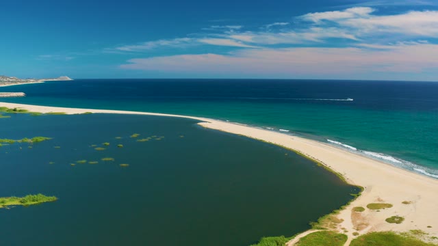SAN JOSE DEL CABO BCS MEXICO-2020: Lagoon and Ocean with Boat Moving Along Shoreline