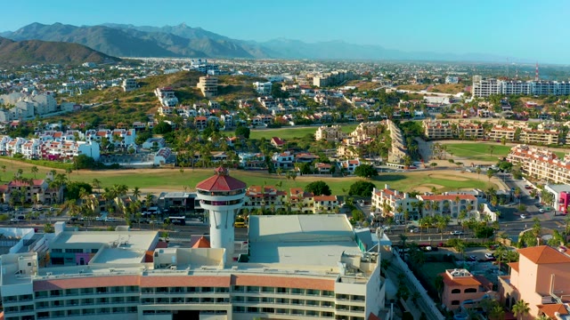 SAN JOSE DEL CABO BCS MEXICO-2020: Cityscape with Water Tower and Mountain Backdrop