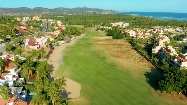 SAN JOSE DEL CABO BCS MEXICO-2020: Golf Course with Residential Buildings and Palm Trees