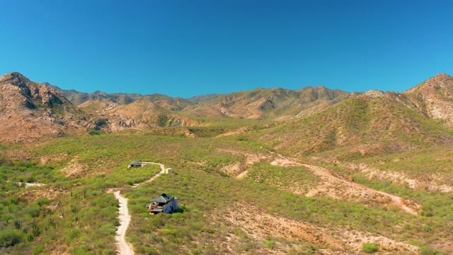 CABO PULMO BCS MEXICO-2020: SUV Driving on a Winding Dirt Road Through Hills