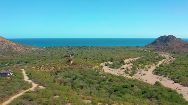 CABO PULMO BCS MEXICO-2020: Vehicle Driving on Coastal Dirt Path Between Hills