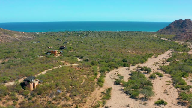CABO PULMO BCS MEXICO-2020: Aerial Pan Across Coastal Shrubland and Structures