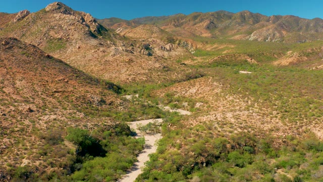 CABO PULMO BCS MEXICO-2020: Winding Dirt Road in Arid Mountain Valley