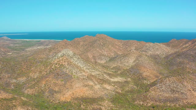 CABO PULMO BCS MEXICO-2020: Pan Across Rugged Mountains and Ocean Horizon