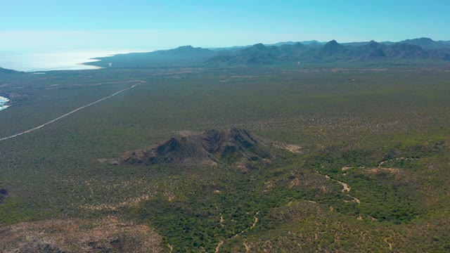 CABO PULMO BCS MEXICO-2020: Vehicle Moving on a Remote Road in Arid Landscape