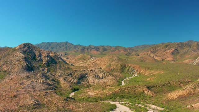 CABO PULMO BCS MEXICO-2020: Mountain Valley with Flowing River and Greenery
