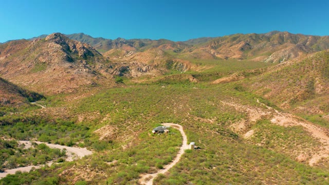CABO PULMO BCS MEXICO-2020: Car Moving Along Winding Mountain Dirt Path