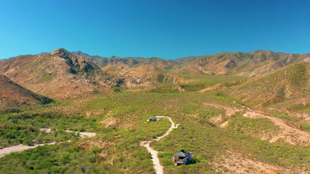 CABO PULMO BCS MEXICO-2020: Vehicle Moving Along Mountainous Dirt Trail