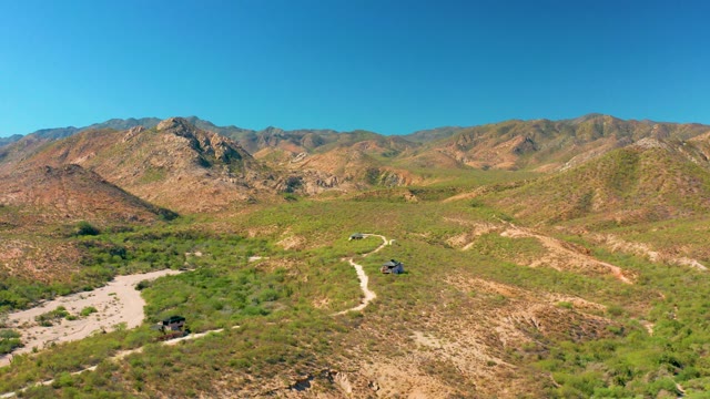 CABO PULMO BCS MEXICO-2020: Vehicles Traveling on Winding Mountain Dirt Road
