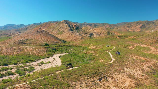 CABO PULMO BCS MEXICO-2020: Vehicles Moving on Winding Mountain Dirt Road
