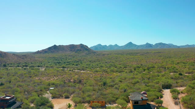 CABO PULMO BCS MEXICO-2020: Desert Landscape with Scattered Homes and Distant Mountains