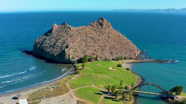 LORETO BCS MEXICO-2020: Rocky Headland Beside Green Field and Coastal Bridge