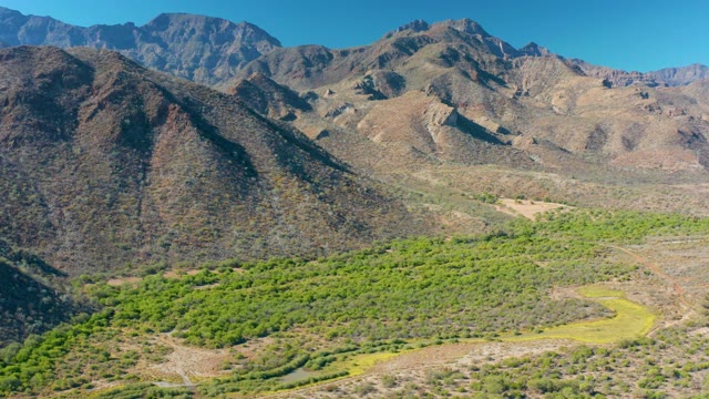 LORETO BCS MEXICO-2020: Winding Path Through Mountain Valley with Green Vegetation