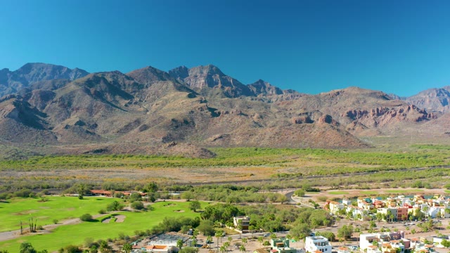 LORETO BCS MEXICO-2020: Vehicles Moving Through a Mountain Valley with Green Fields