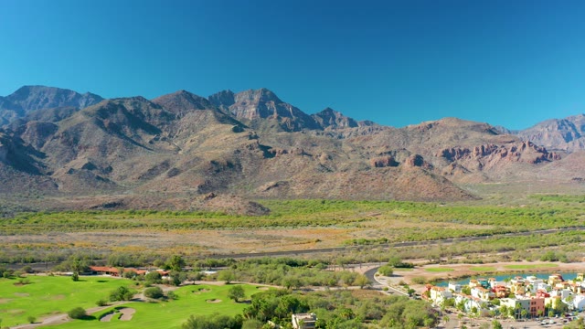 LORETO BCS MEXICO-2020: Panning View of Mountainous Landscape with Road and Green Field