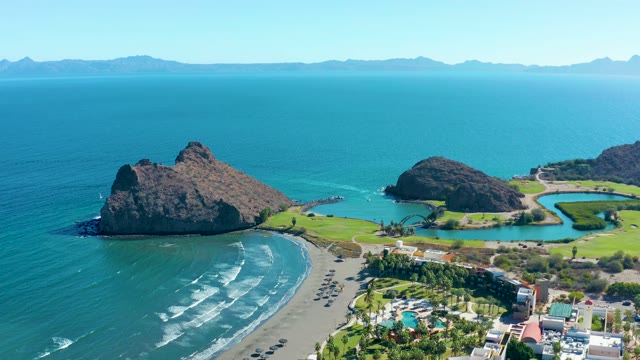 LORETO BCS MEXICO-2020: Beach with Rocky Outcrops and Moving Vehicles
