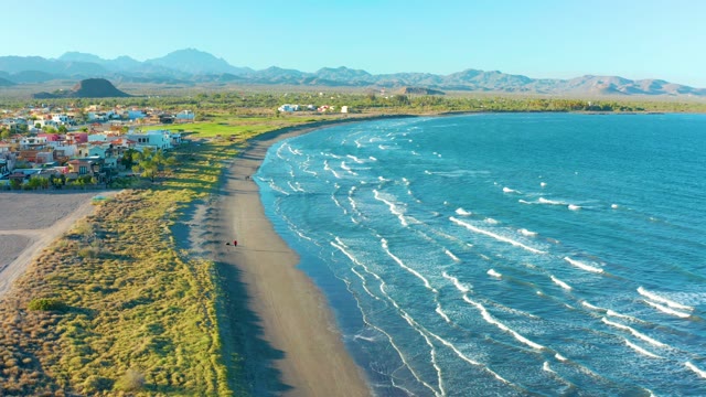 LORETO BCS MEXICO-2020: Person Walking on Curved Black Sand Beach
