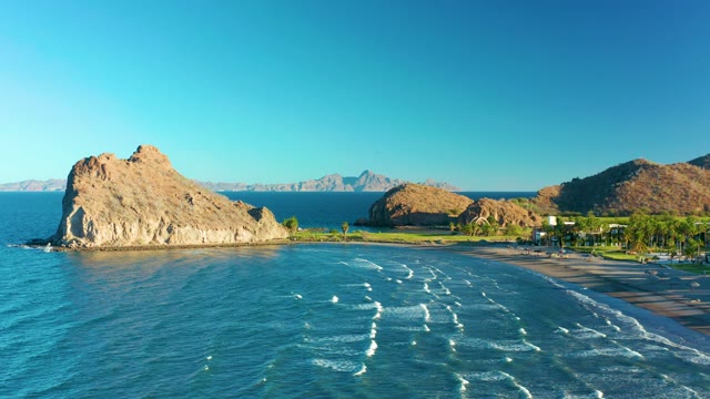 LORETO BCS MEXICO-2020: Rocky Outcrop and Beach with Rolling Ocean Waves