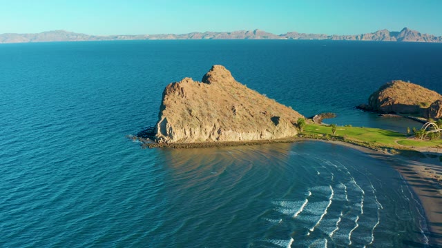 LORETO BCS MEXICO-2020: Coastal Rock Formation with Ocean Waves and Sandy Shore