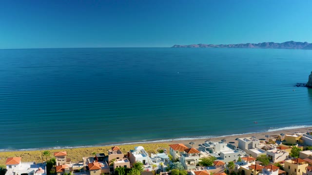 LORETO BCS MEXICO-2020: Sandy Beach with People and Coastal Buildings