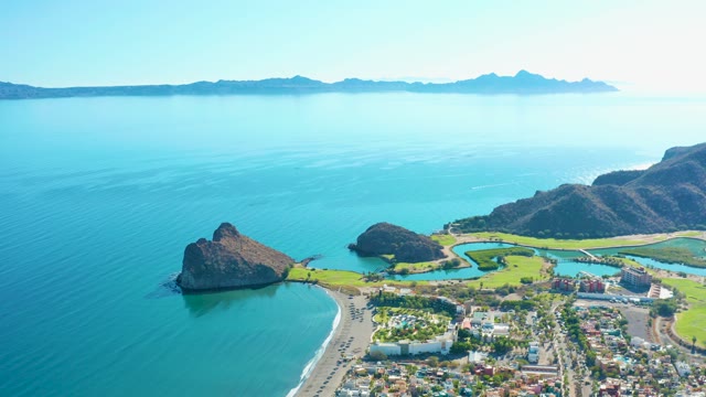 LORETO BCS MEXICO-2020: Vehicles Moving Along Coastal Road Beside Sandy Beach