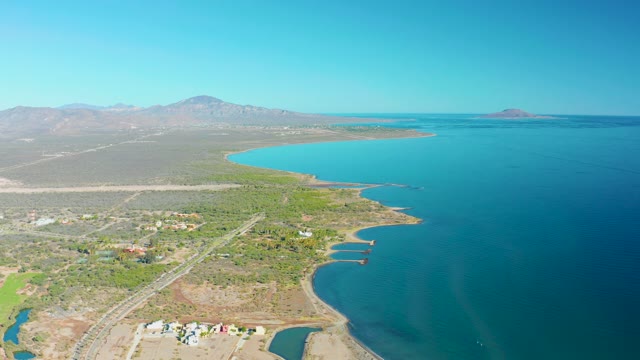 LORETO BCS MEXICO-2020: Coastal Highway with Moving Vehicles and Desert Terrain