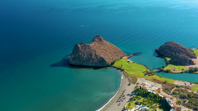 LORETO BCS MEXICO-2020: Rocky Island and Coastal Shore with Moving Vehicles