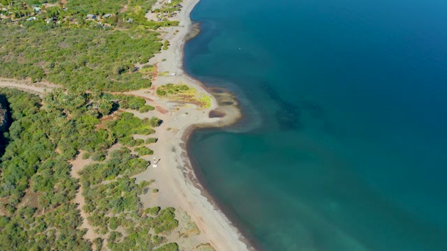 LORETO BCS MEXICO-2020: Car Driving on Sandy Beach near Coastal Greenery