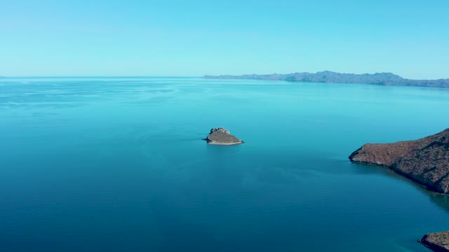 JUNCALITO BCS MEXICO-2020: Small Rocky Island Drifting in Calm Ocean