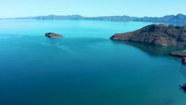 JUNCALITO BCS MEXICO-2020: Rocky Islands in Turquoise Water with Distant Mountains