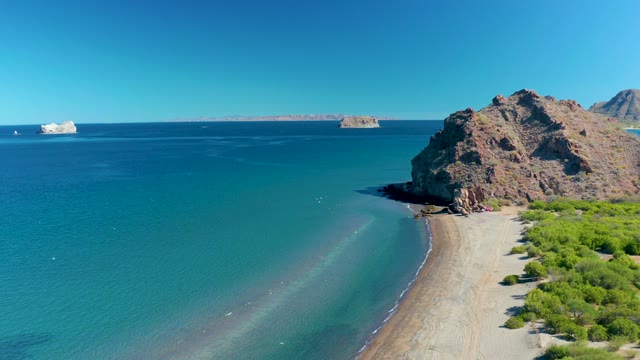 LIGUI BCS MEXICO-2020: Gentle Waves Lapping Sandy Coastline with Rocky Outcrop
