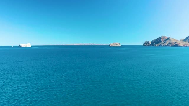 LIGUI BCS MEXICO-2020: Calm Ocean with Distant Islands and Moving Boat