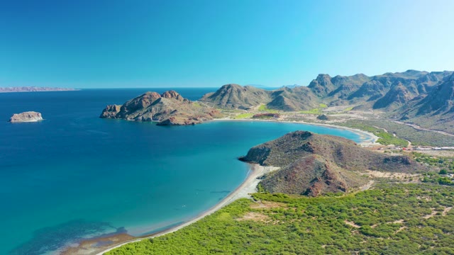 LIGUI BCS MEXICO-2020: Vehicle Driving Along Coastal Road near Rocky Beach
