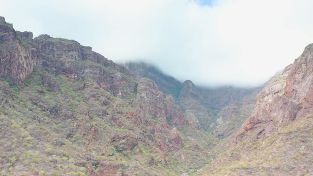 PUERTO ESCONDIDO BCS MEXICO-2020: Clouds Drifting Over Rugged Mountain Valley