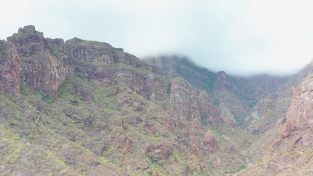 PUERTO ESCONDIDO BCS MEXICO-2020: Clouds Drifting Over Rugged Mountain Peaks