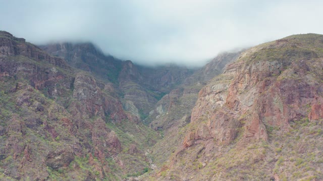 PUERTO ESCONDIDO BCS MEXICO-2020: Clouds Drifting Over Rugged Mountain Valley