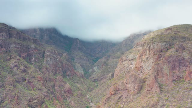 PUERTO ESCONDIDO BCS MEXICO-2020: Clouds Drifting Over Rugged Mountain Valley