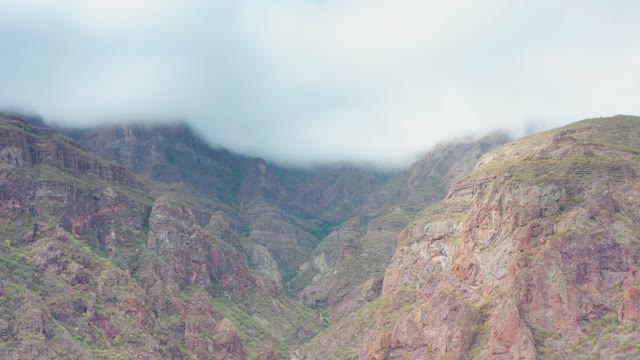 PUERTO ESCONDIDO BCS MEXICO-2020: Clouds Drifting Over Rugged Mountain Peaks