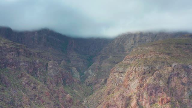 PUERTO ESCONDIDO BCS MEXICO-2020: Clouds Drifting Over Mountain Valley and Rocky Peaks