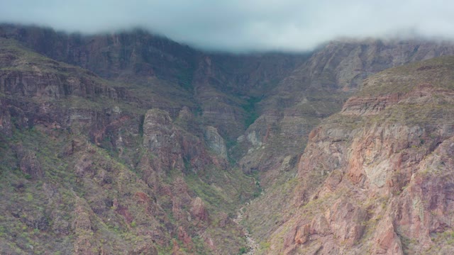 PUERTO ESCONDIDO BCS MEXICO-2020: Mountain Valley with Clouds and Rocky Slopes