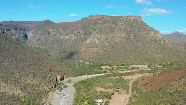 SAN JAVIER BCS MEXICO-2020: Riverside Valley with Mountain Peaks and Shifting Cloud Shadows