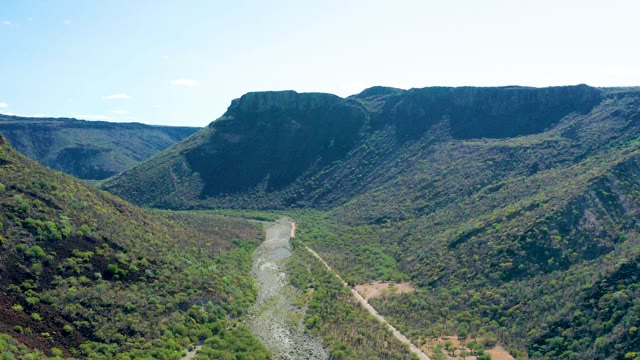 SAN JAVIER BCS MEXICO-2020: River Winding Through Forested Mountain Valley
