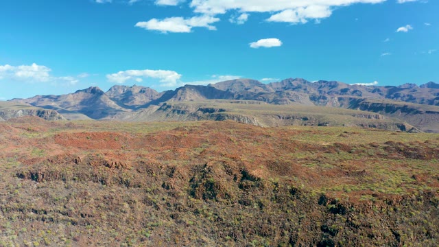 SAN JAVIER BCS MEXICO-2020: Red Rock Terrain and Distant Mountain Range