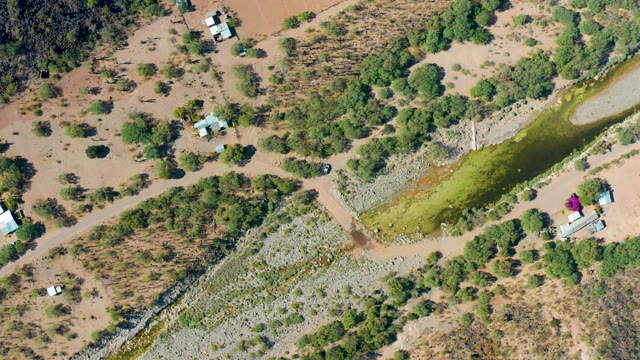 SAN JAVIER BCS MEXICO-2020: Arid Campsite with Van Departing