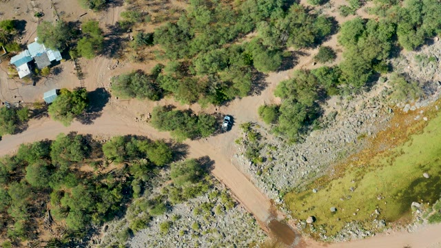 SAN JAVIER BCS MEXICO-2020: Dry Riverbed with Scattered Trees and Small Building
