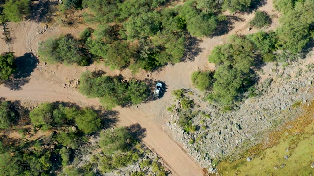 SAN JAVIER BCS MEXICO-2020: Car Driving on Forested Dirt Road