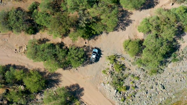 SAN JAVIER BCS MEXICO-2020: Car Moving on a Dusty Forest Road